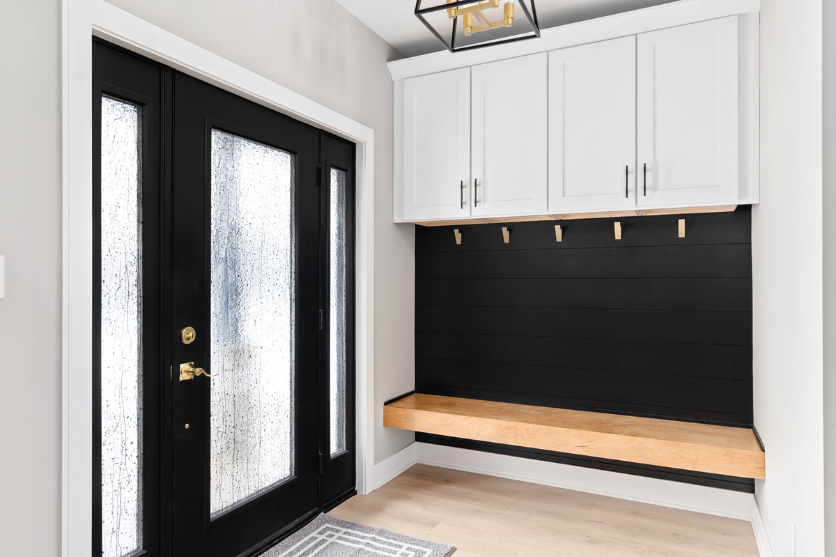 Custom mudroom built-in with lockers, bench, and storage by Century Kitchens & Bath