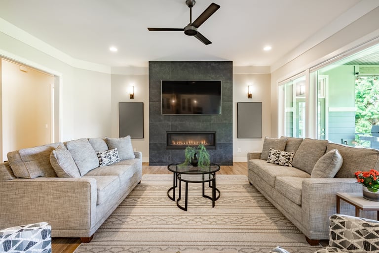 Fireplace remodel project by Century Kitchens & Bath with elegant stone surround