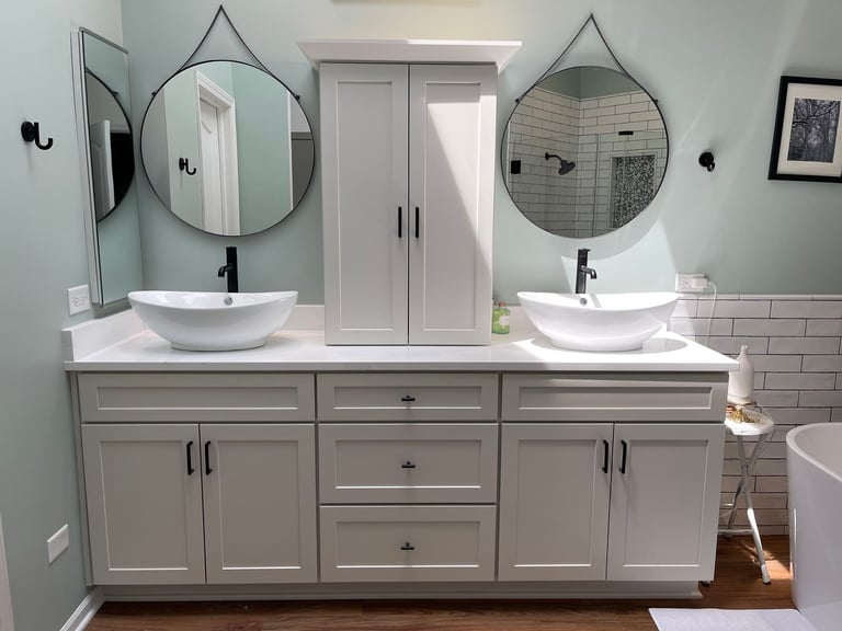 Powder room remodel in Libertyville, IL by Century Kitchens & Bath with statement tile and designer vanity